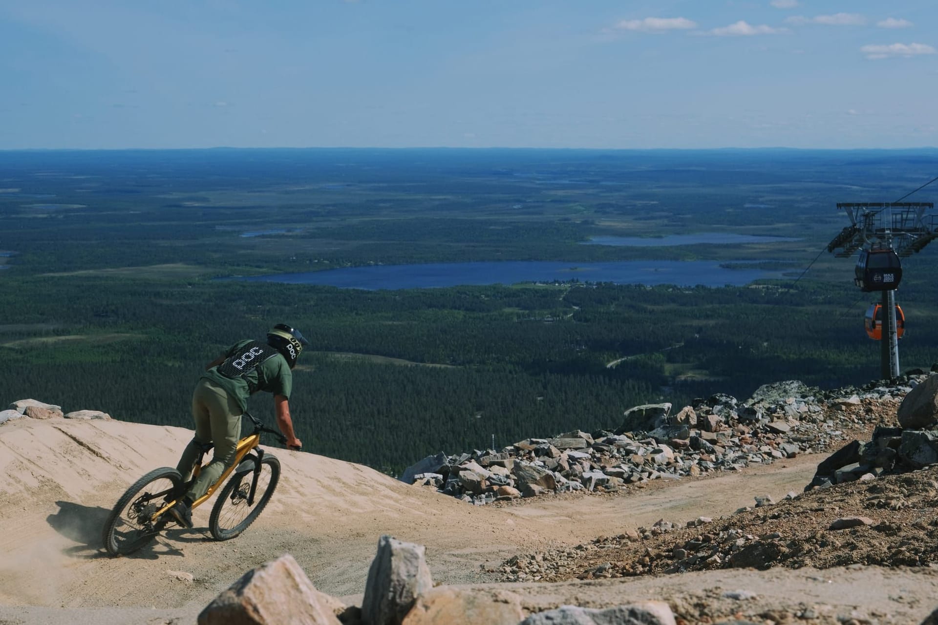 Rider launching off a large jump on the 95980 Murica trail at Ylläs Bike Park