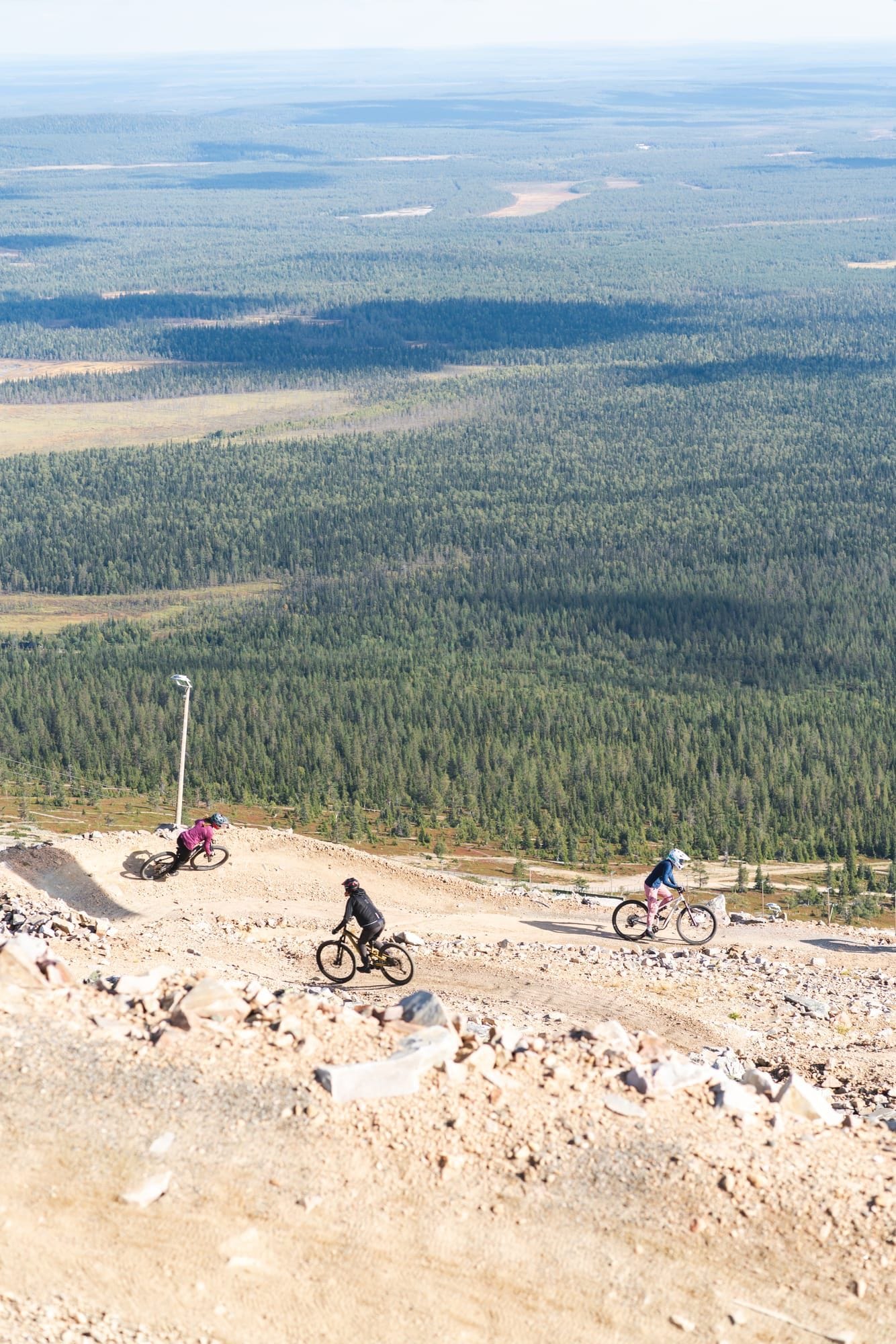 Mountain biker hitting a double drop on the 95980 Murica trail at Ylläs