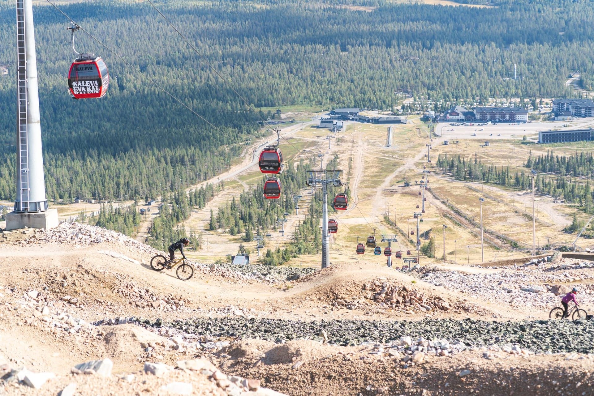 Mountain biker hitting a drop on the 95980 Murica trail at Ylläs