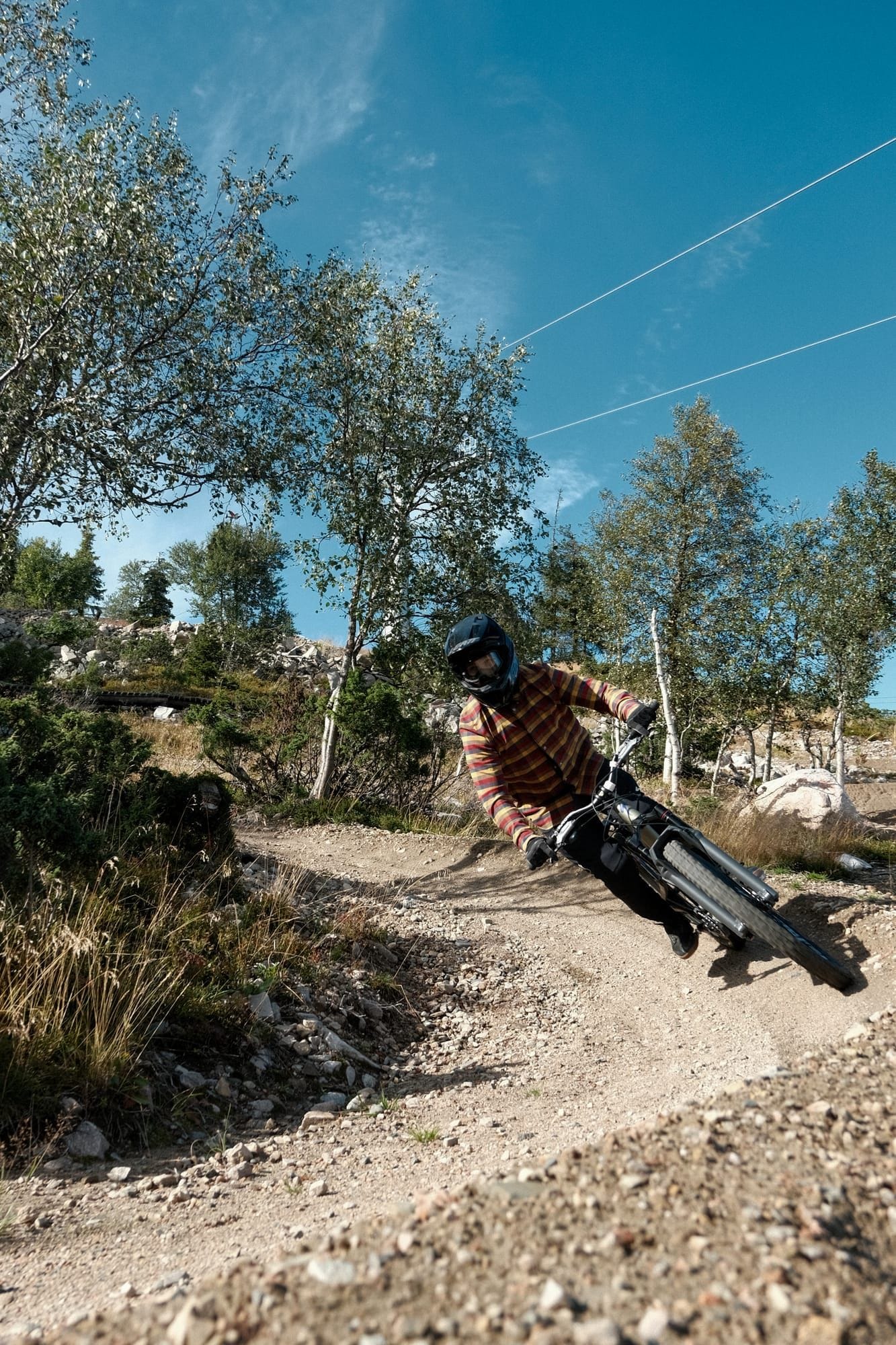 Rider carving a berm on the Appetizer flow trail at Ylläs Bike Park