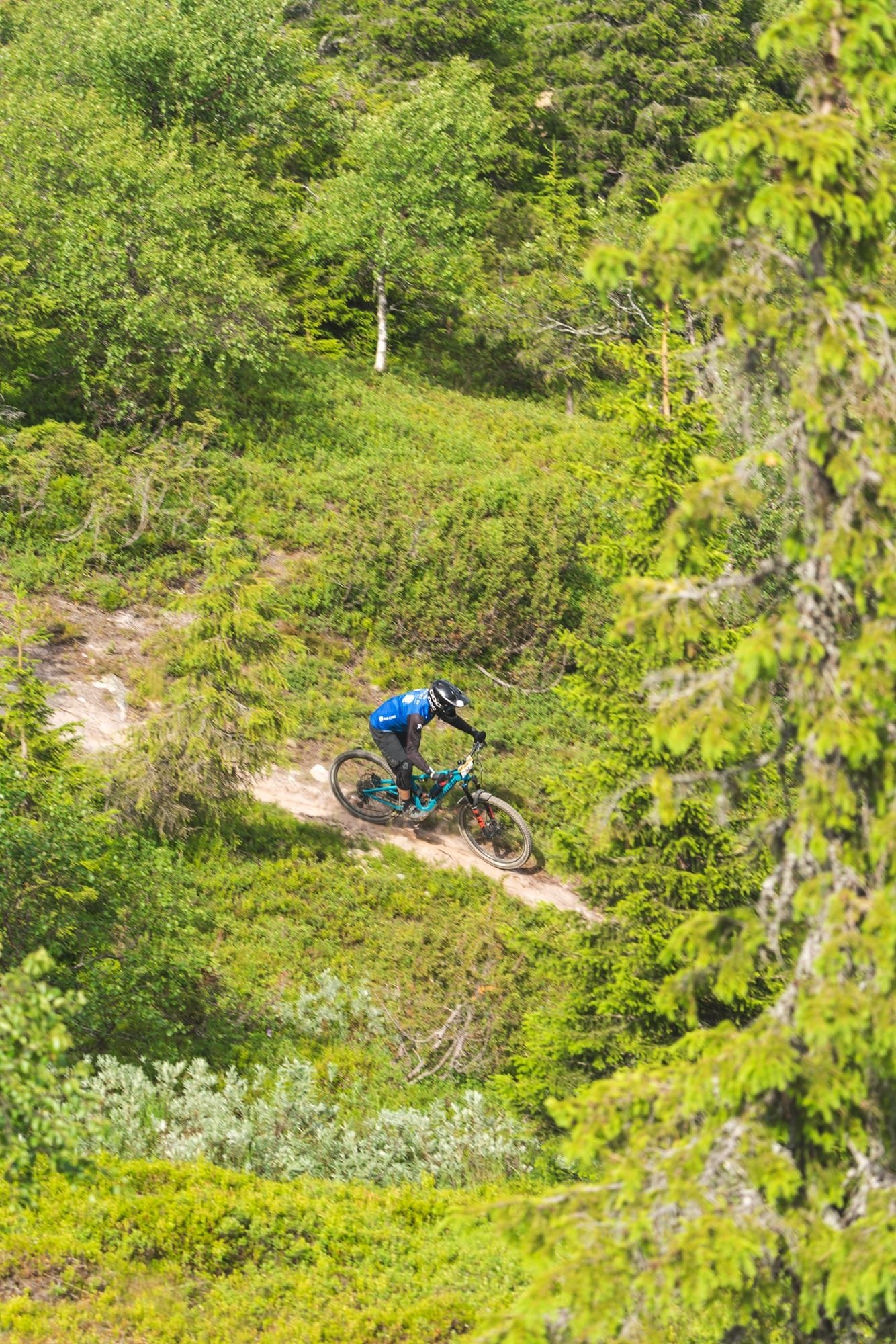 Mountain biker at speed on the Lower Twist trail at Ylläs Bike Park