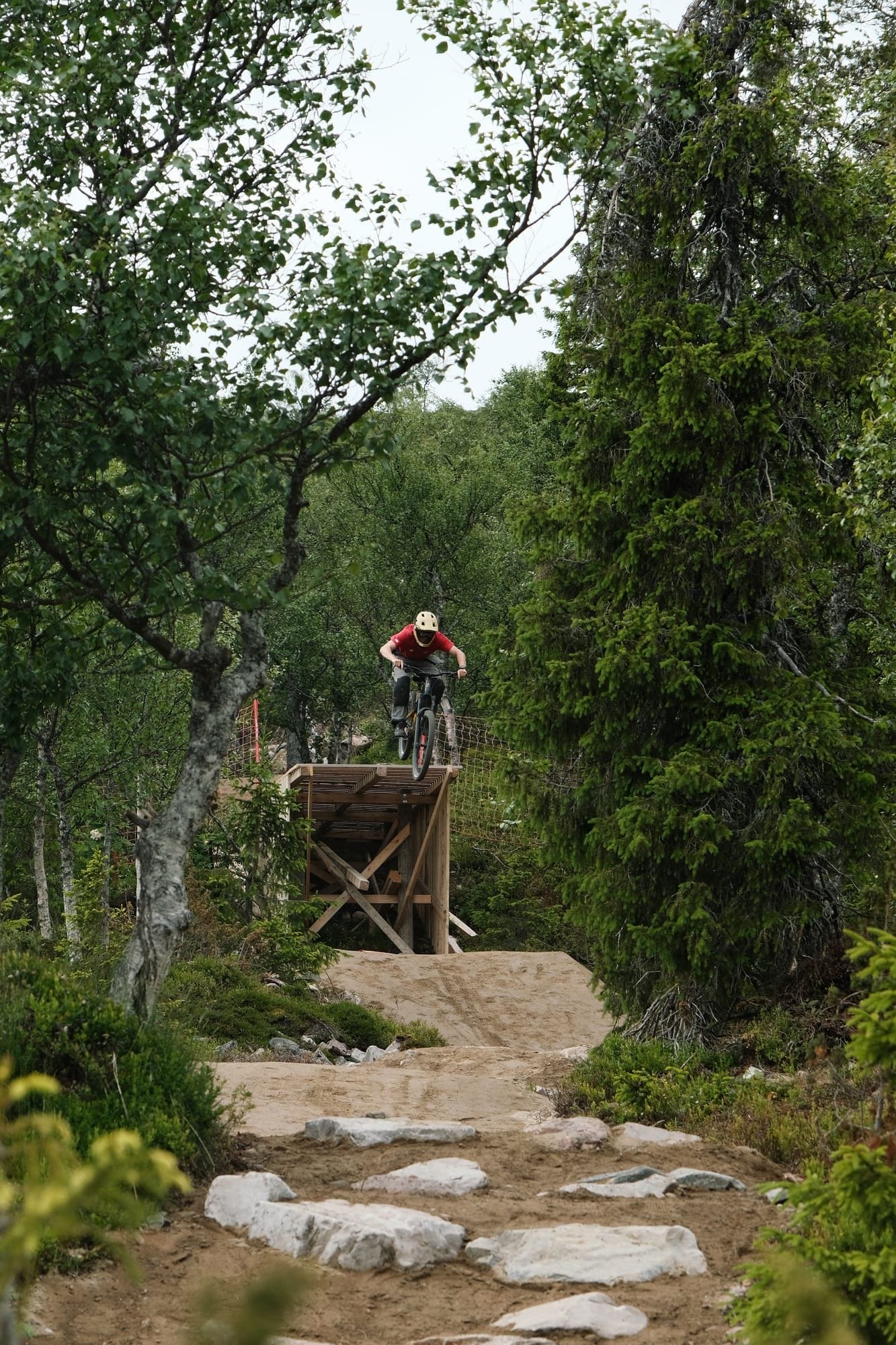 Rider in a technical rock garden on Mr. Hankey trail at Ylläs Bike Park