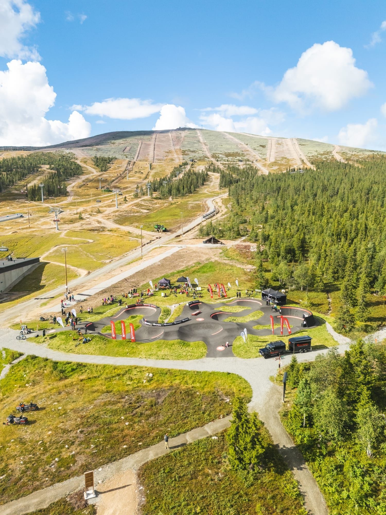 Mountain biker carving a berm on the Ylläs pump track