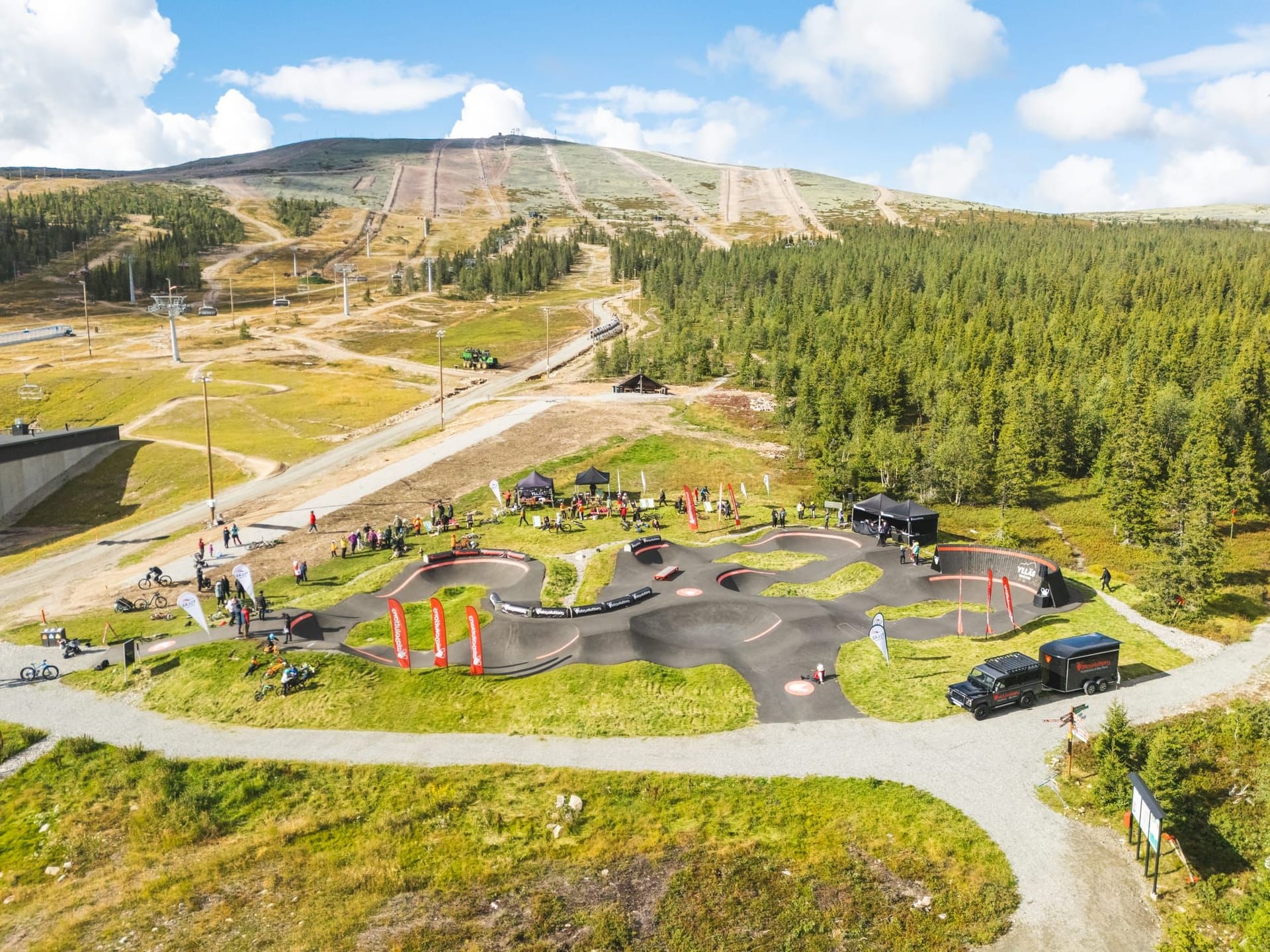 Rider on the jump line of the Ylläs Bike Park pump track