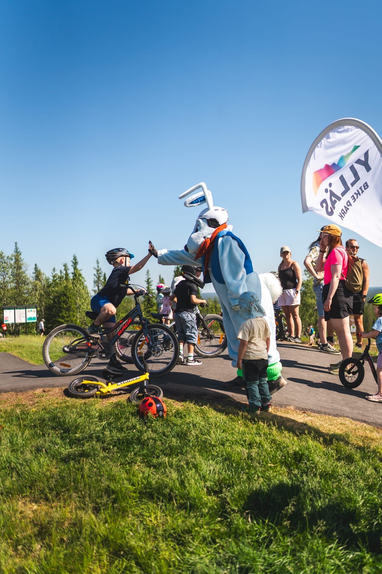Rider pumping rollers on the Ylläs Bike Park pump track
